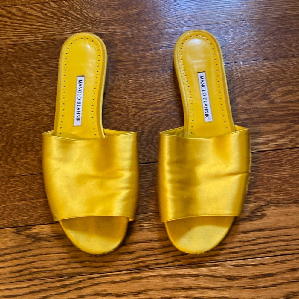 Manolo Blahnik yellow satin flat sandals.